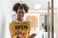 A business sign that word Ã¢â¬ËOpenÃ¢â¬â¢ on cafe or restaurant hang on door at entrance. Royalty Free Stock Photo